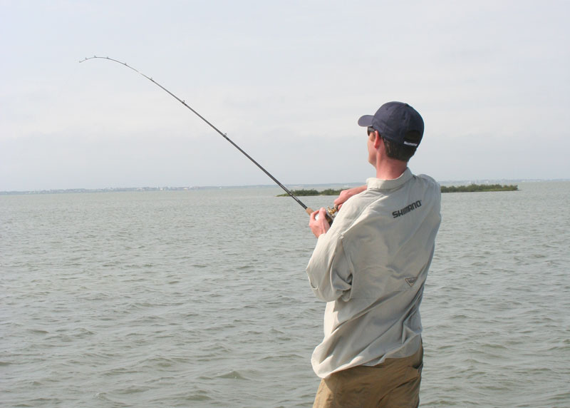 a man fishing in saltwater