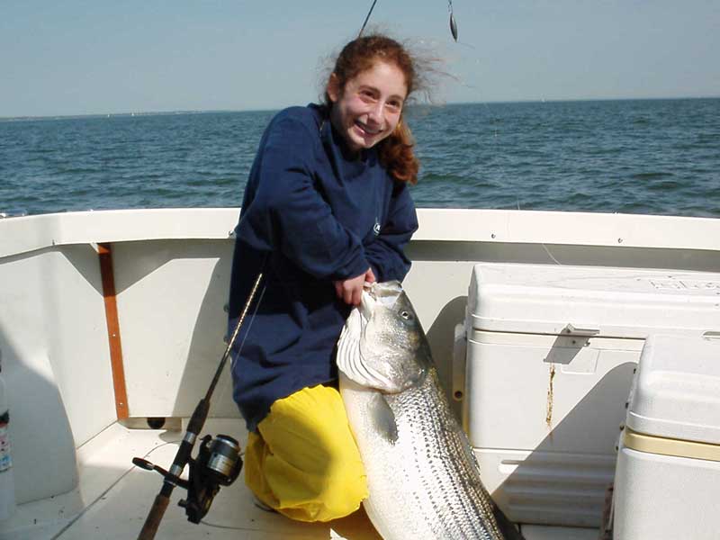 kid catches monster striper