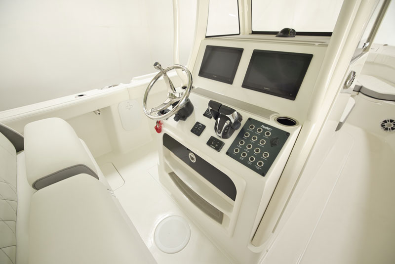 helm of the parker fathom 274 center console fishing boat