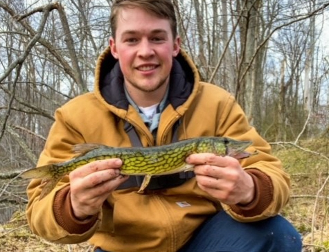 angler with a pickerel fish